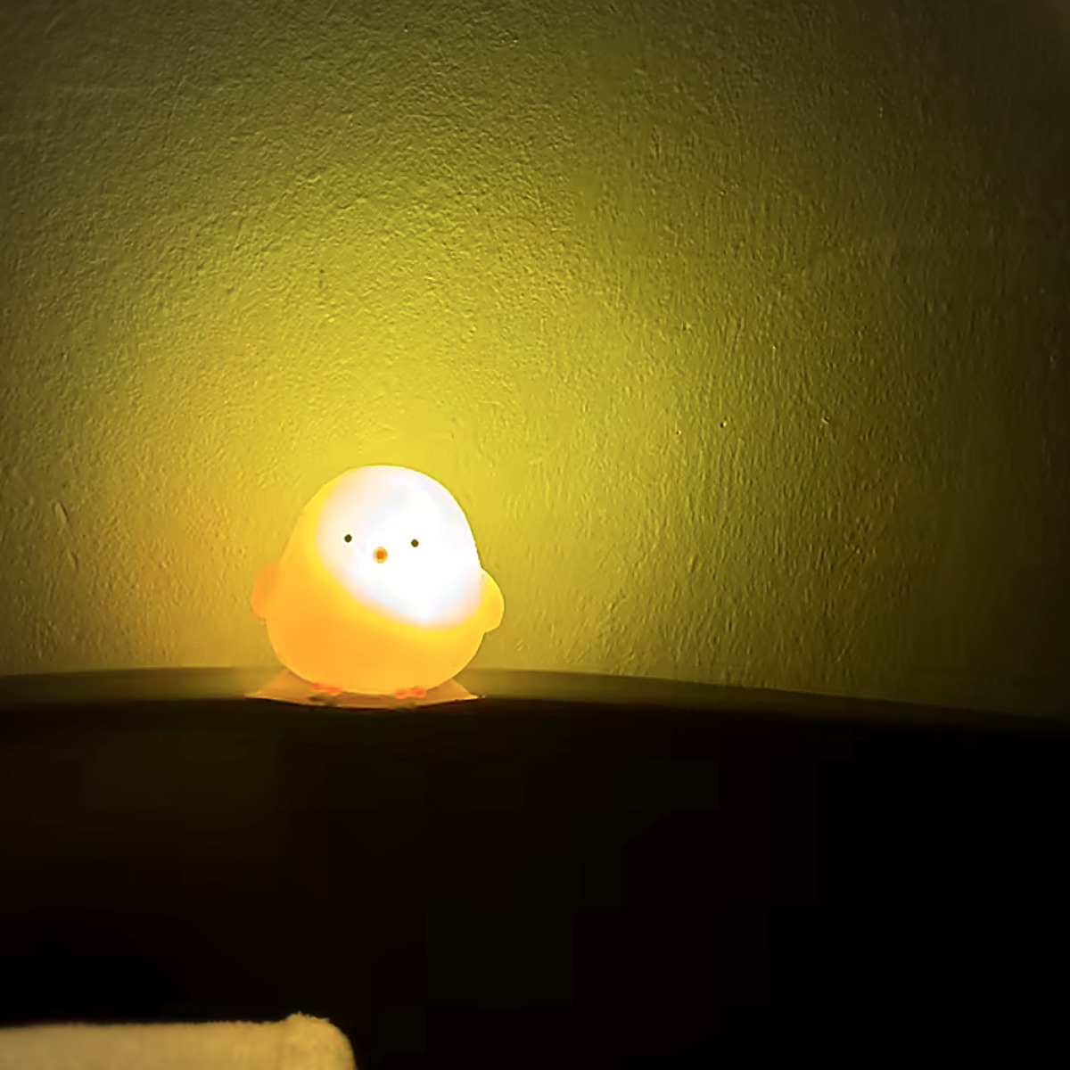 Chick Glow Buddy lighting up a dark wall