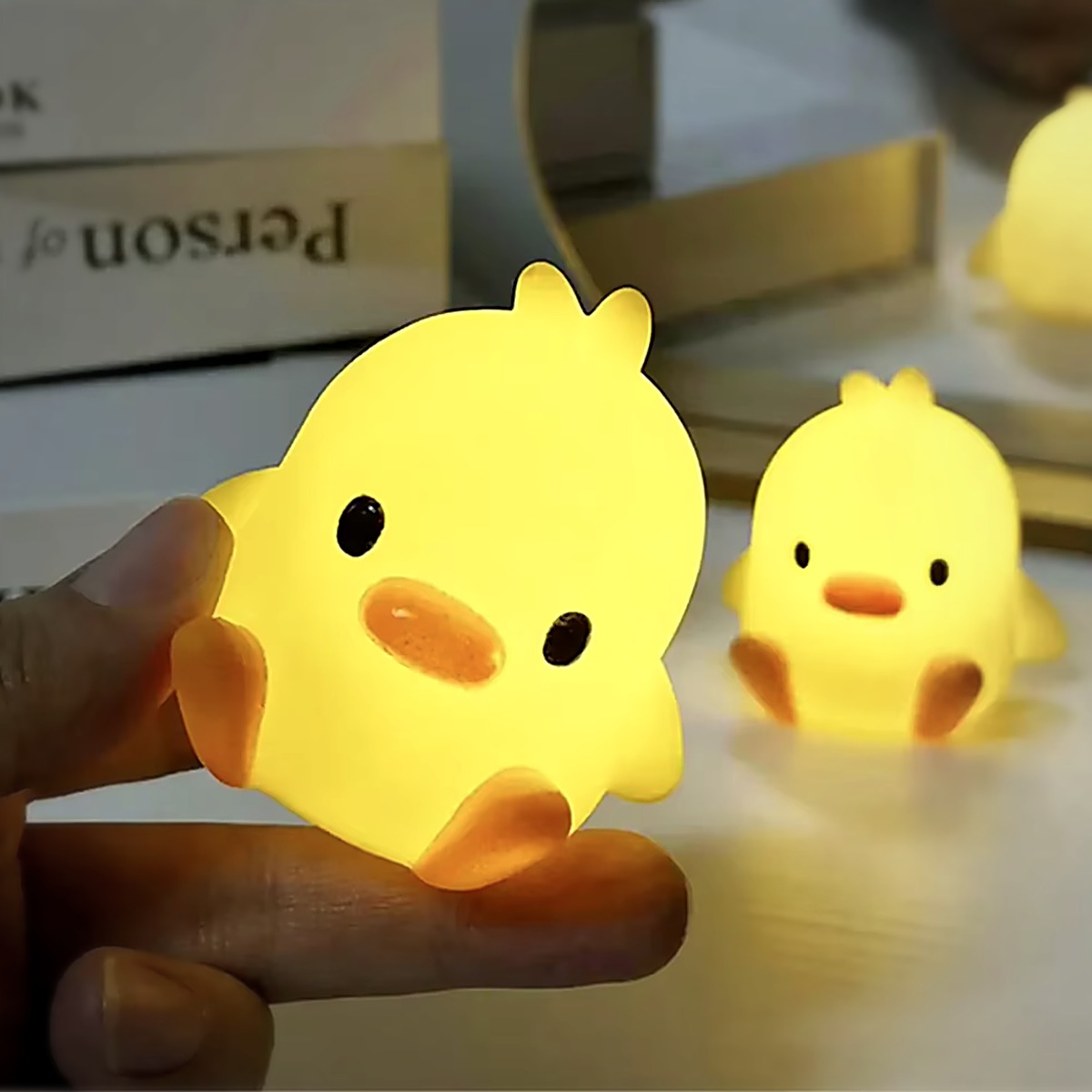 Two Duck Glow Buddies glowing side by side